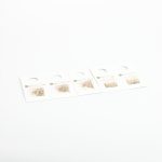 set of diverse stud earrings on white display cards against a white background